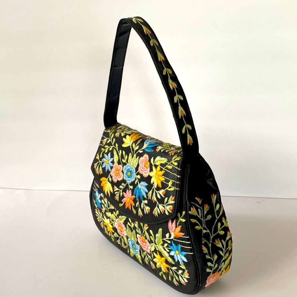 Black handbag with embroidered flowers
